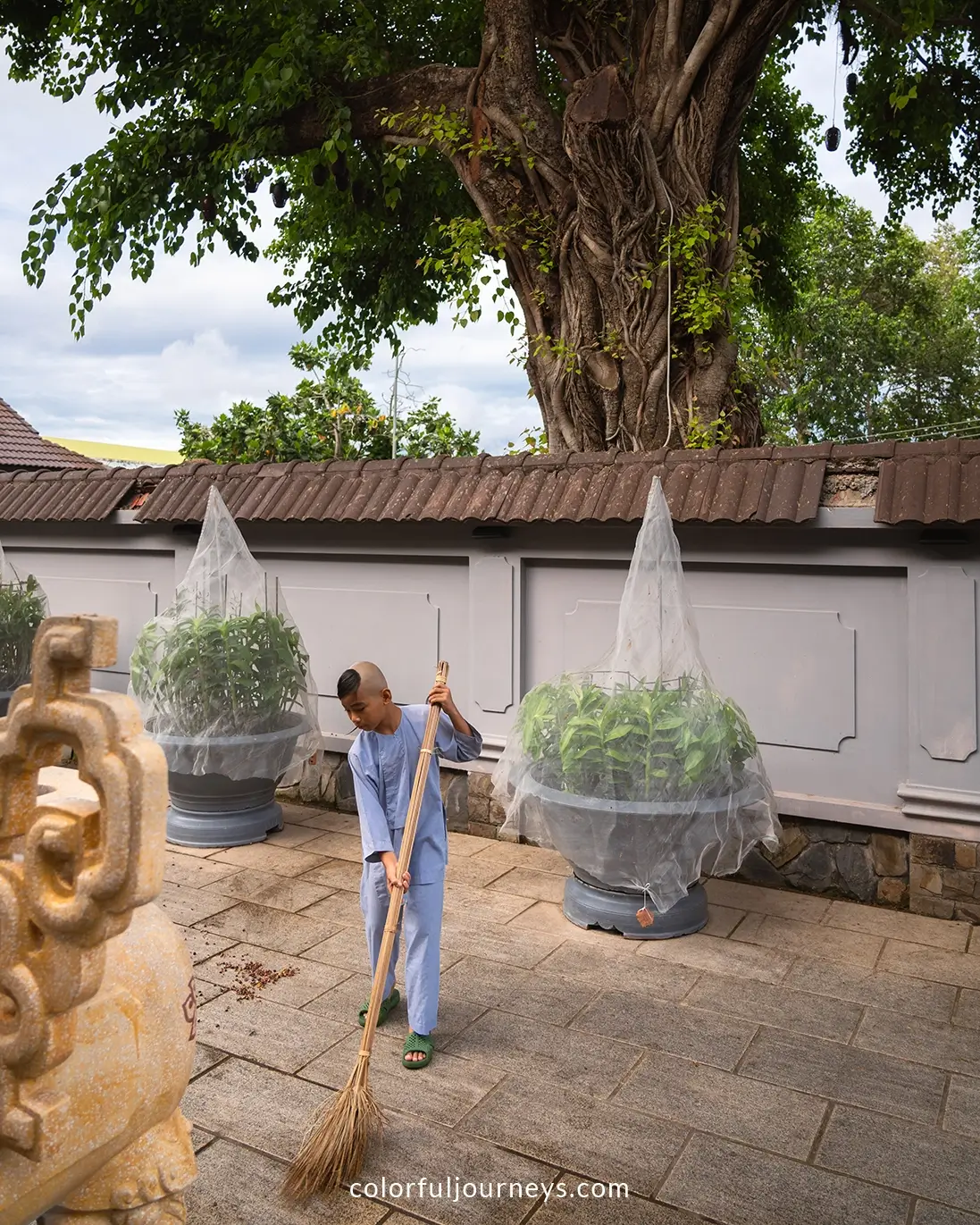 A young monk sweeps the premises of Phat Da pagoda in Ha Tien, Vietnam