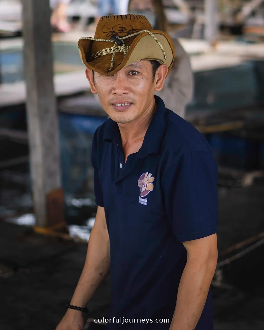 A man catches fish at a seafood restaurant on Con Doa Island, Vietnam