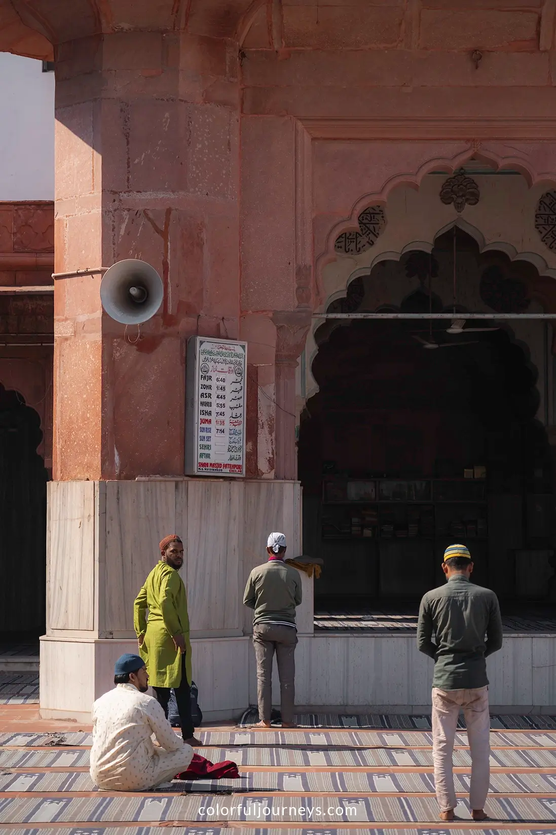 Men pray at Fatehpur Masjid in Delhi, India