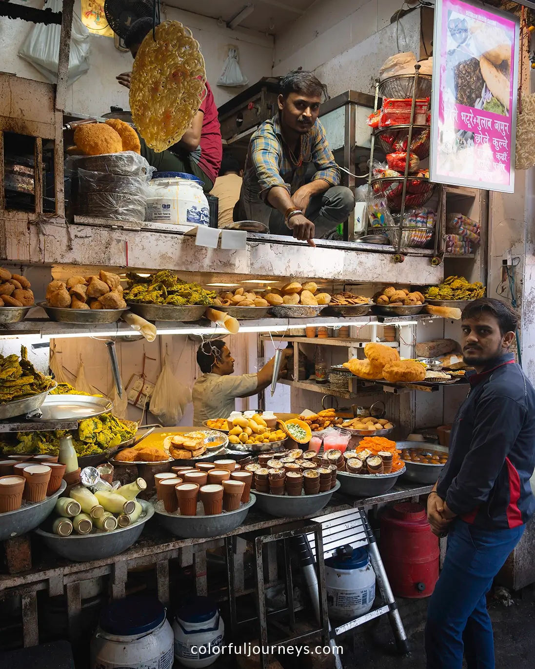 Men sell food on the streets in Delhi, India