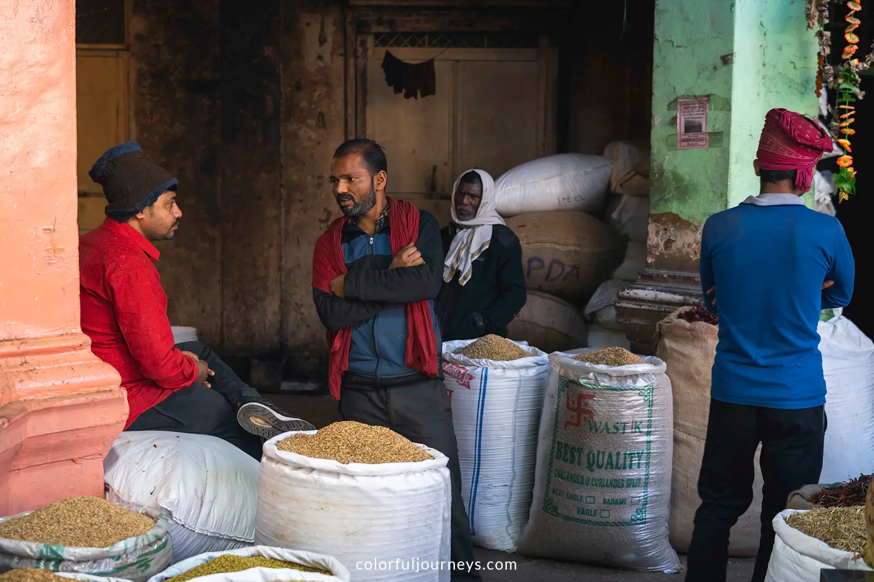 Men at a spice market in Delhi, India