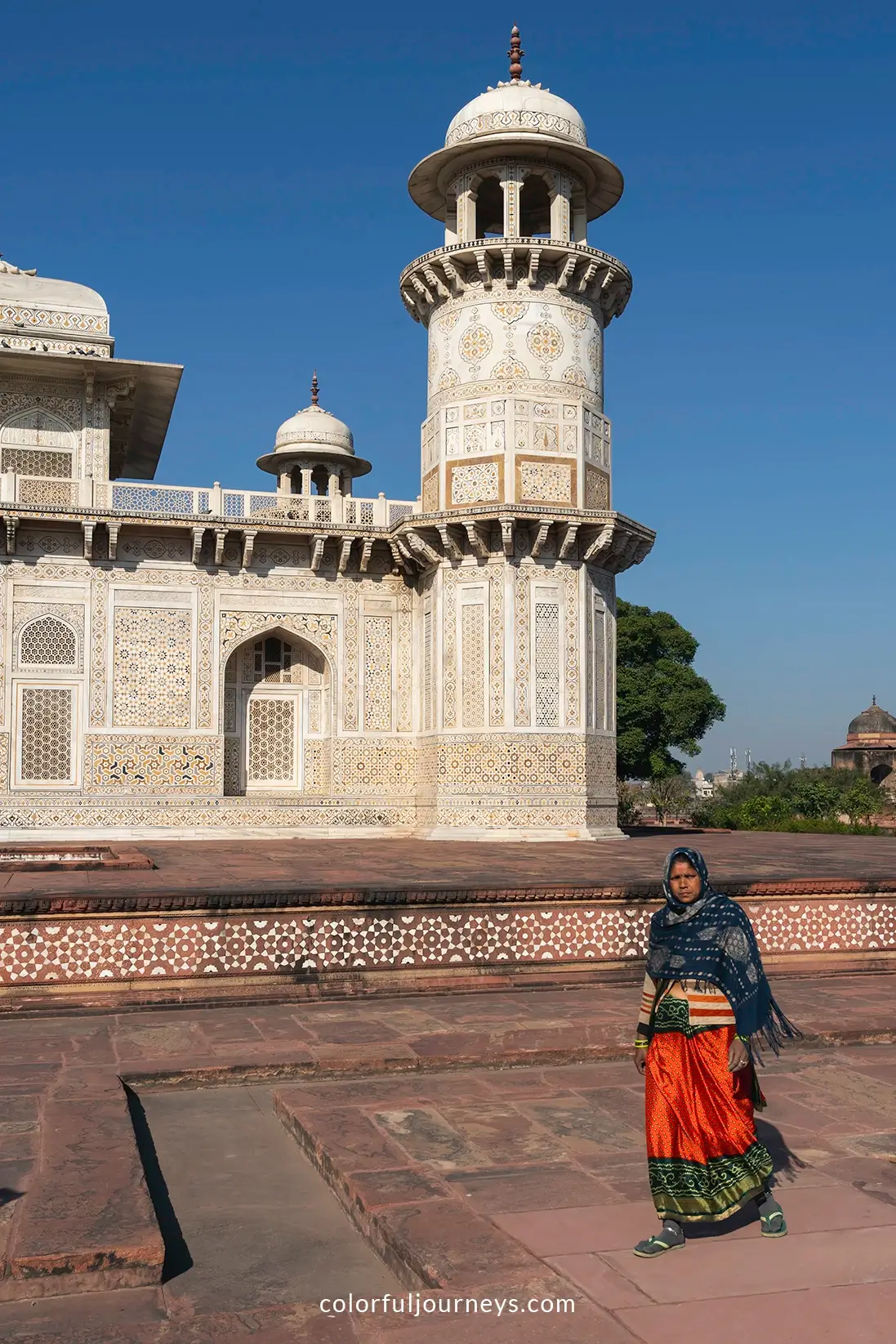 A woman walks into a house in Delhi, India