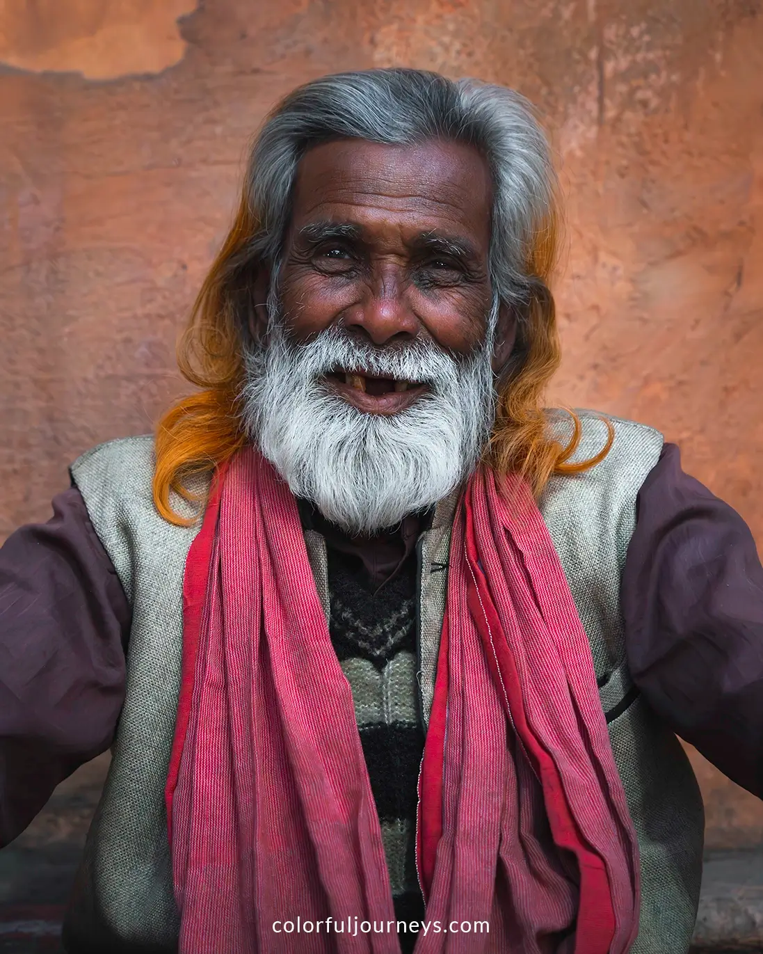 A man smiles at the camera in Jaipur, India