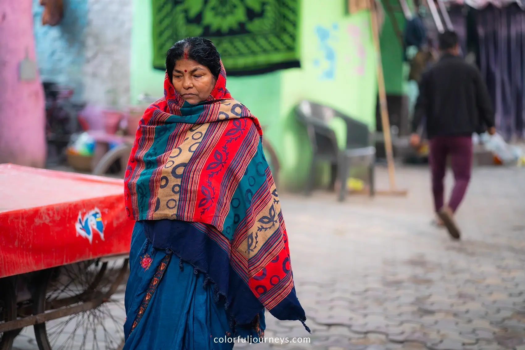 A woman wearing colorful clothes near the Yamuna Ghat in Delhi, India