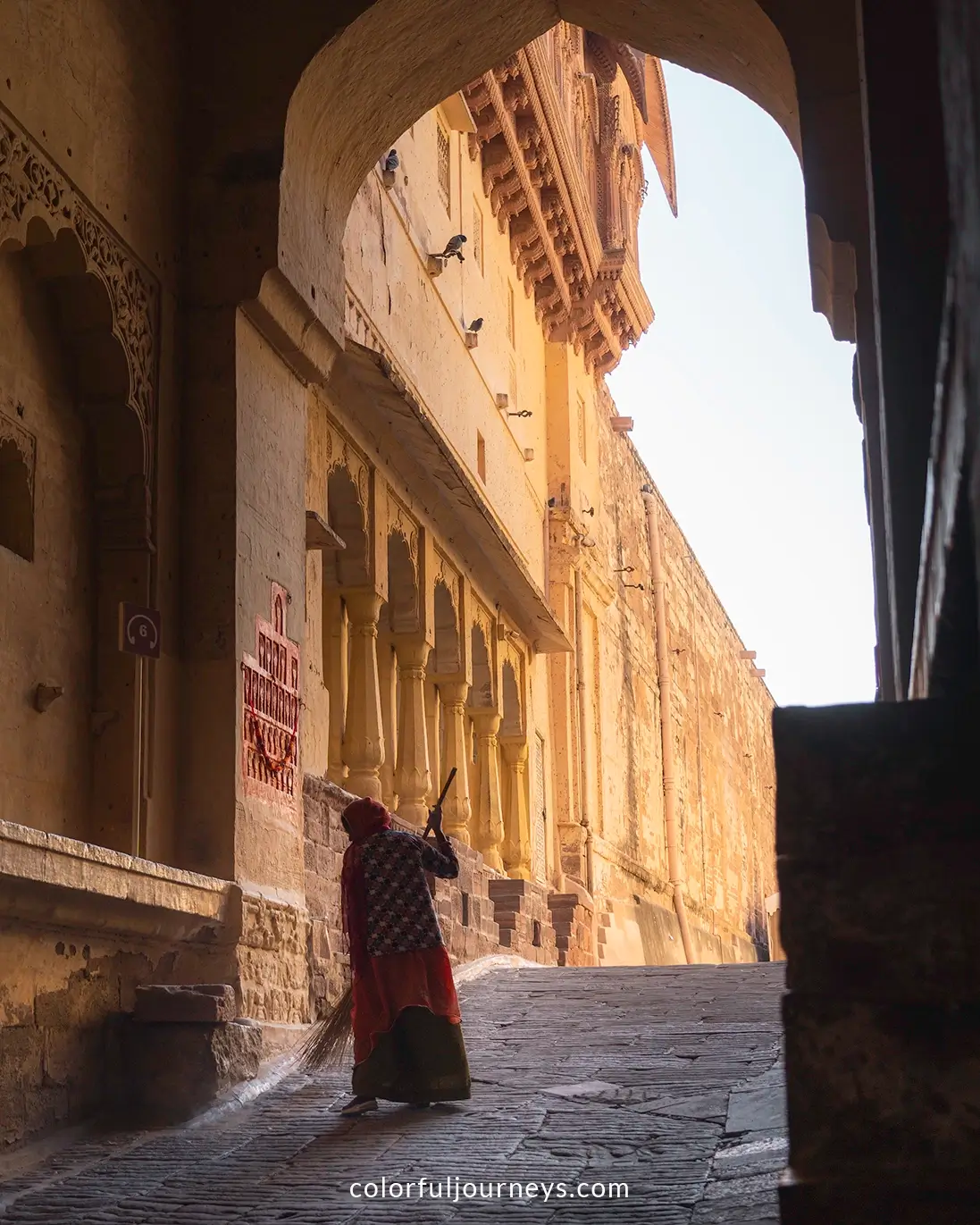 Women sweep the grounds at Mehrangarh Fort in Jodhpur, India
