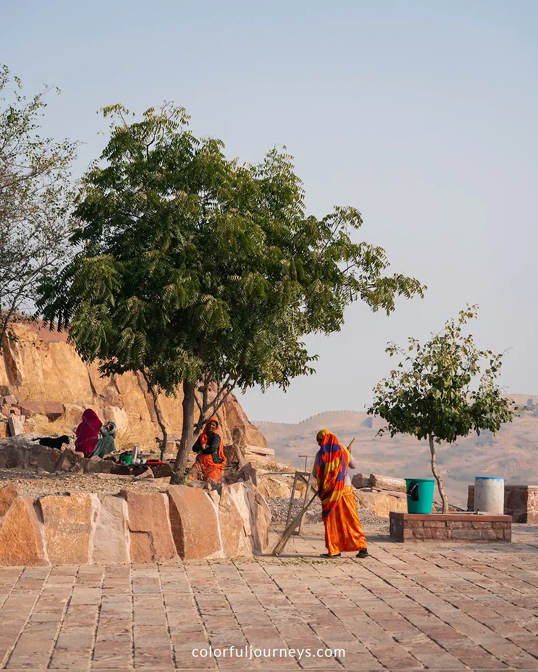 Women sweep the grounds at Mehrangarh Fort in Jodhpur, India