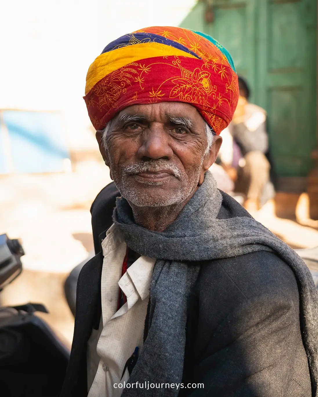 A man smiles at the camera in Jodhpur, India