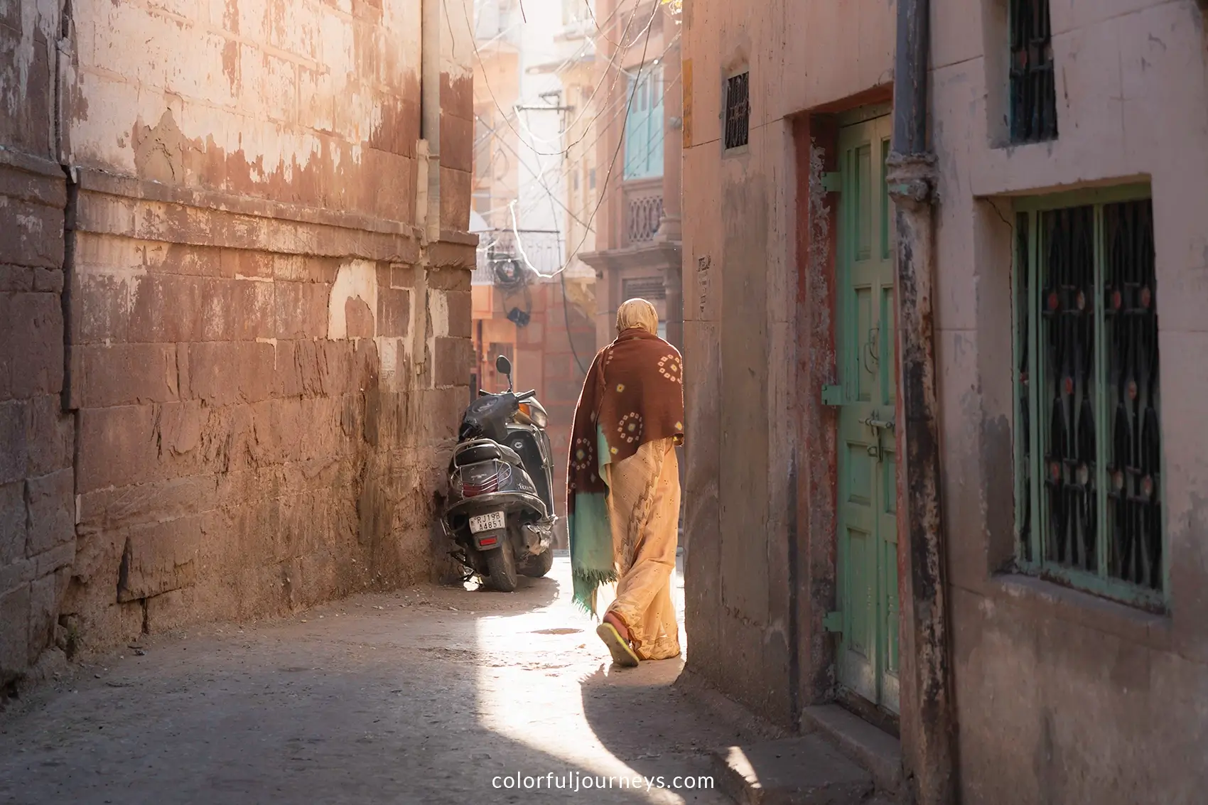 A woman walks the streets of Jodhpur, India