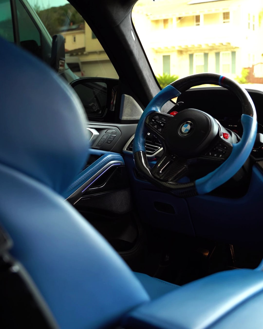 BMW blue leather interior - steering wheel and M Sport seats