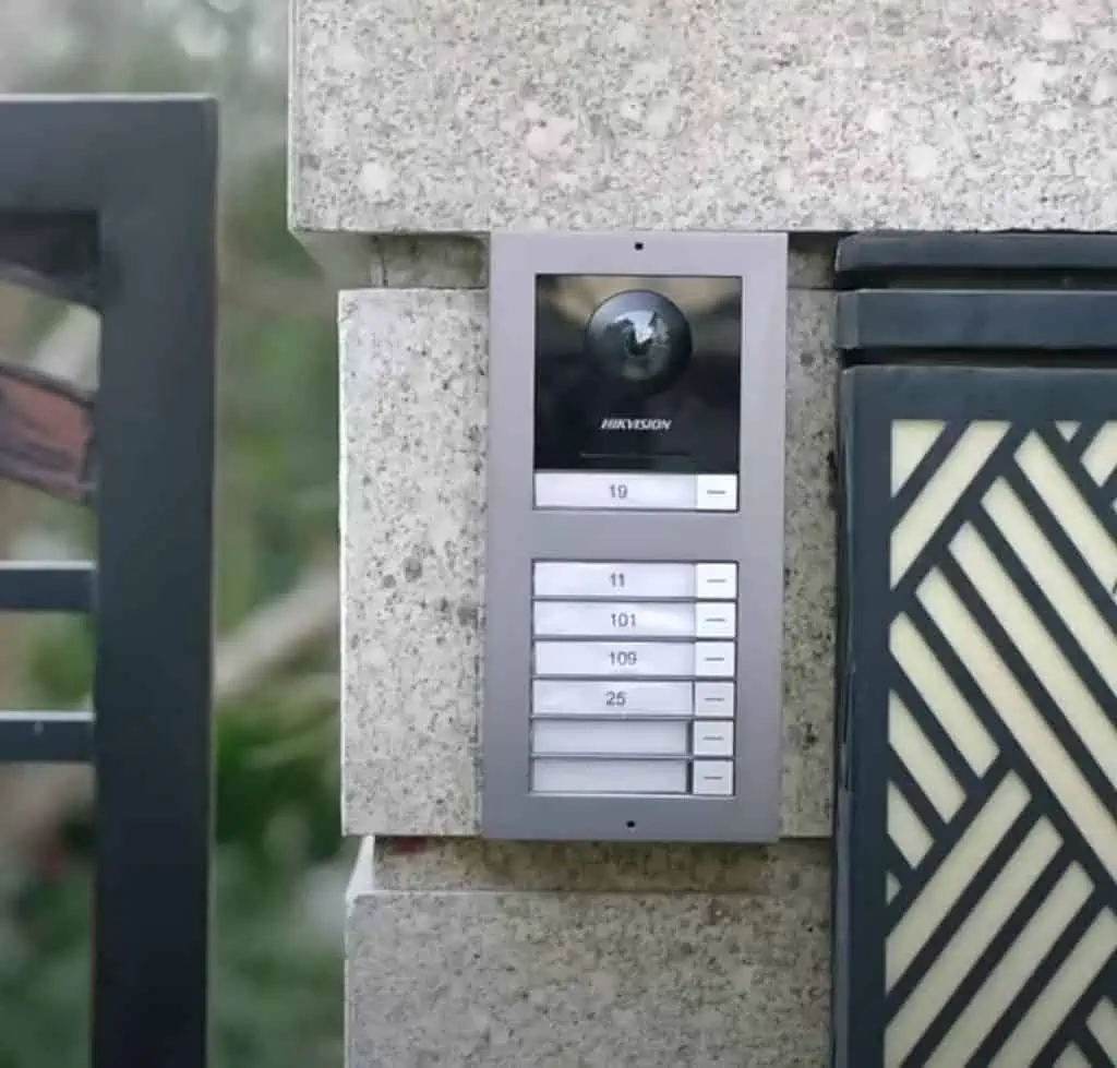 Commax intercom system, used for communication between rooms or building entrances, featuring a display screen and control buttons.