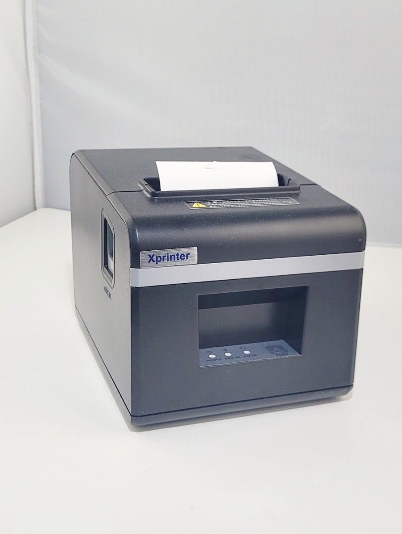 Xprinter thermal printer, used for printing receipts or labels, typically found in retail or logistics environments.