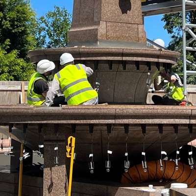 Conservators working on light fittings