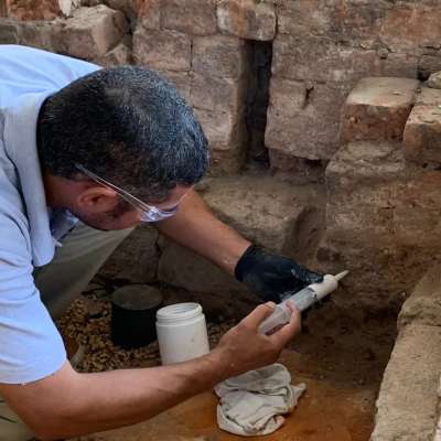 ICS conservators plugging pest holes 