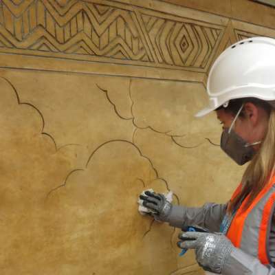Conservators at work in the Melocco Room 