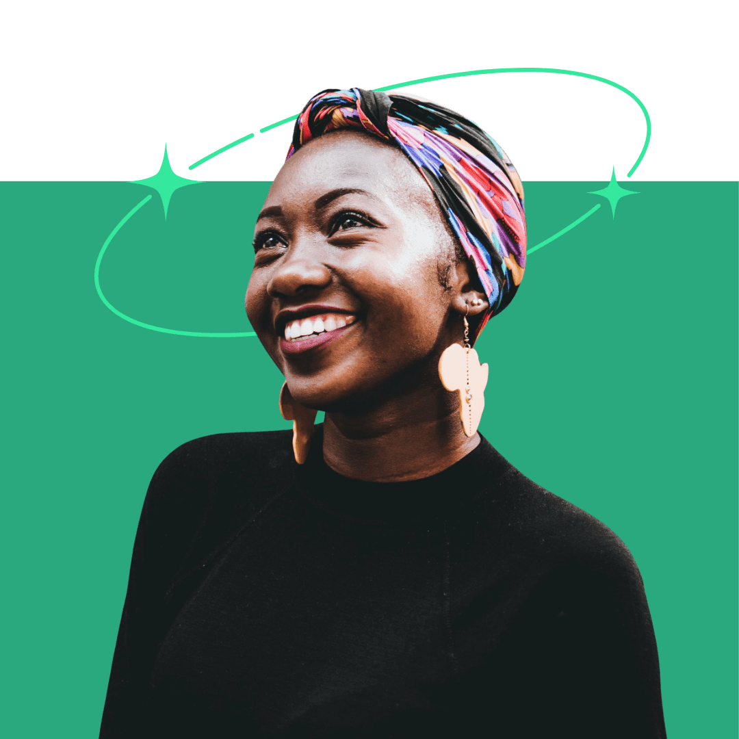 Young african lady gazing through the sky with a happy face.