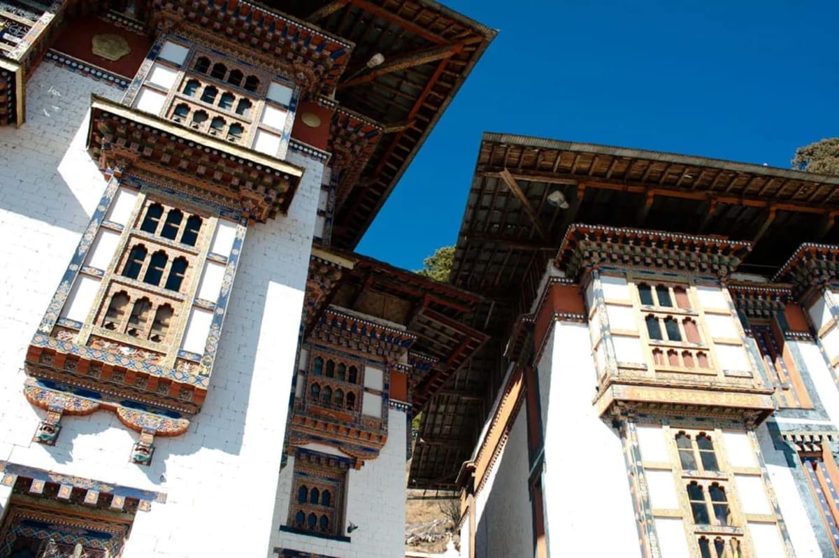 Autumn light on sacred temple roofs in the Bumthang valley