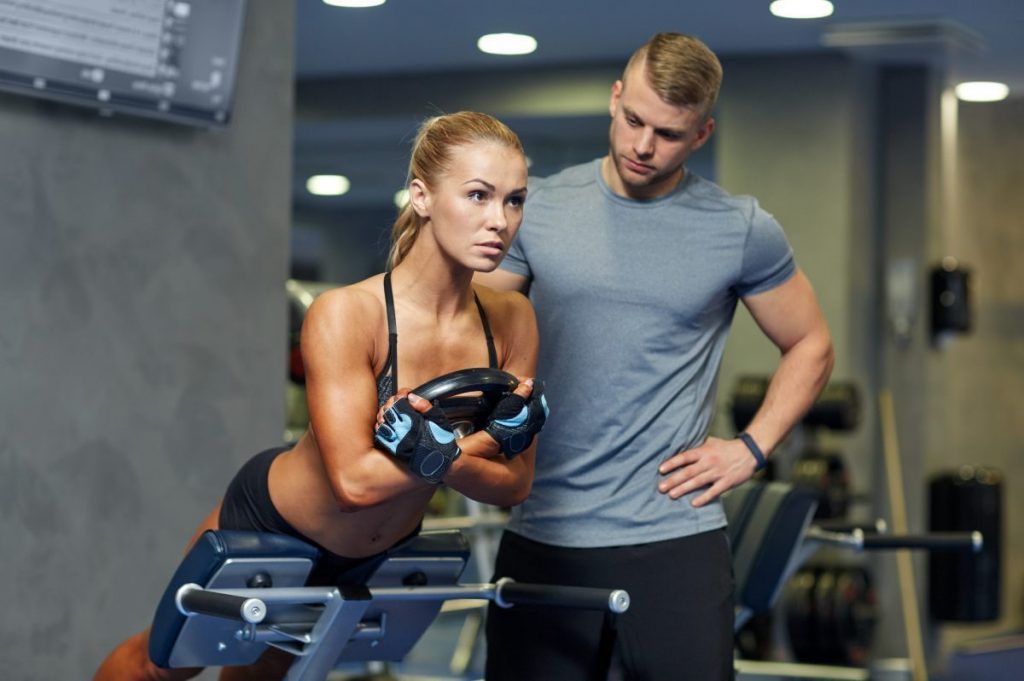 Personal trainer and his strong client - Virtuagym