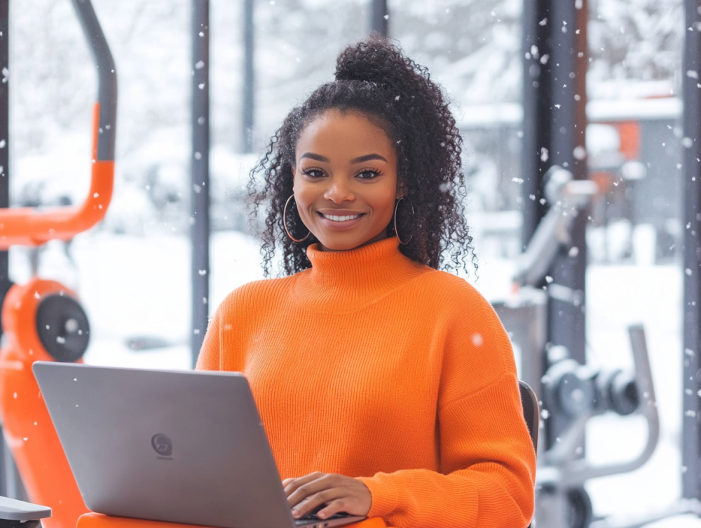 A certified personal trainer working on her laptop