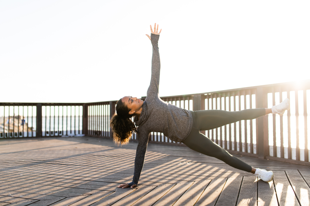 A woman doing a side plank