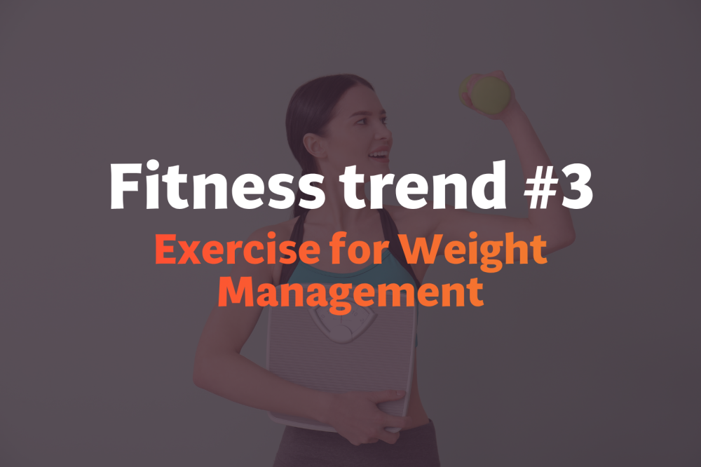 Trainer motivates a woman performing a kettlebell swing, showcasing high intensity interval training and exercise stimulus.