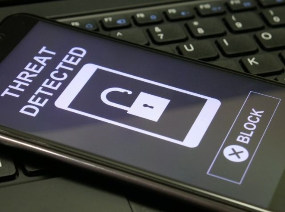 Screen of phone with phrase Threat detected