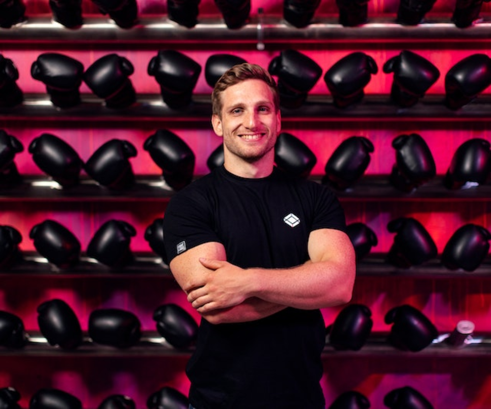 Personal trainer on the box gloves background