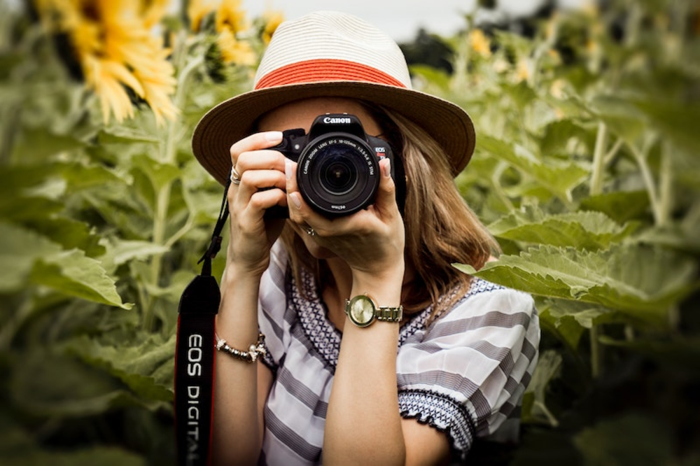 A woman holding a camera