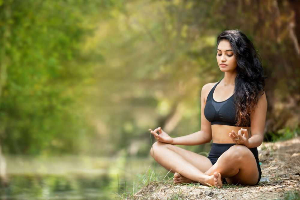 Woman meditating in nature