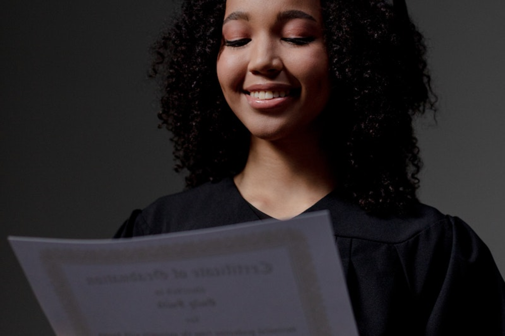 A woman holding a certificate