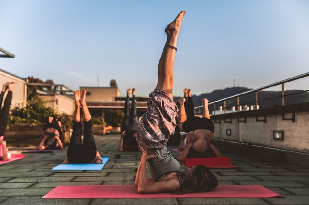 A group of people performing yoga