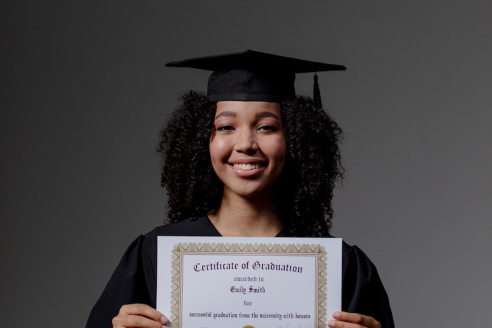 A woman holding a certificate