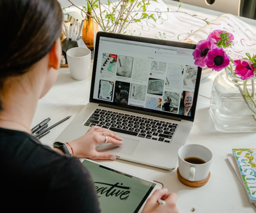 A woman browing the web on her laptop