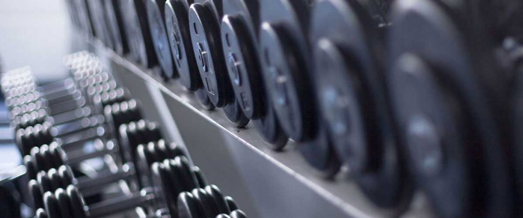 row of dumbbells of different weights