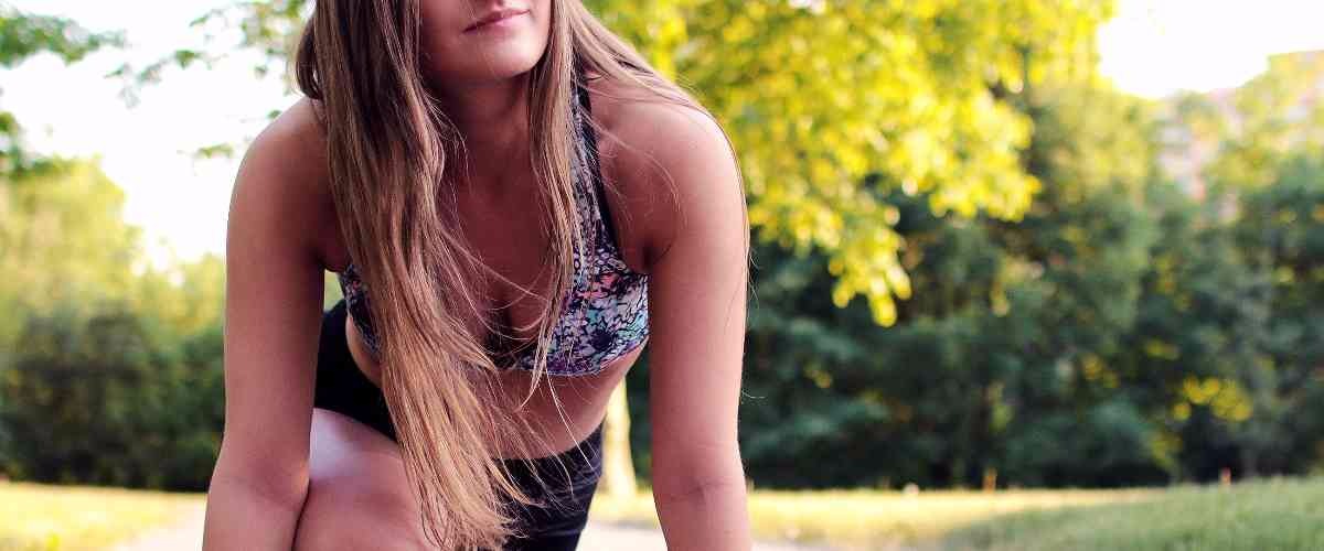 woman doing stretches in a park