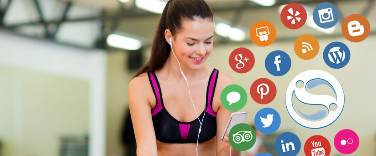 woman in a gym looking at various social media apps