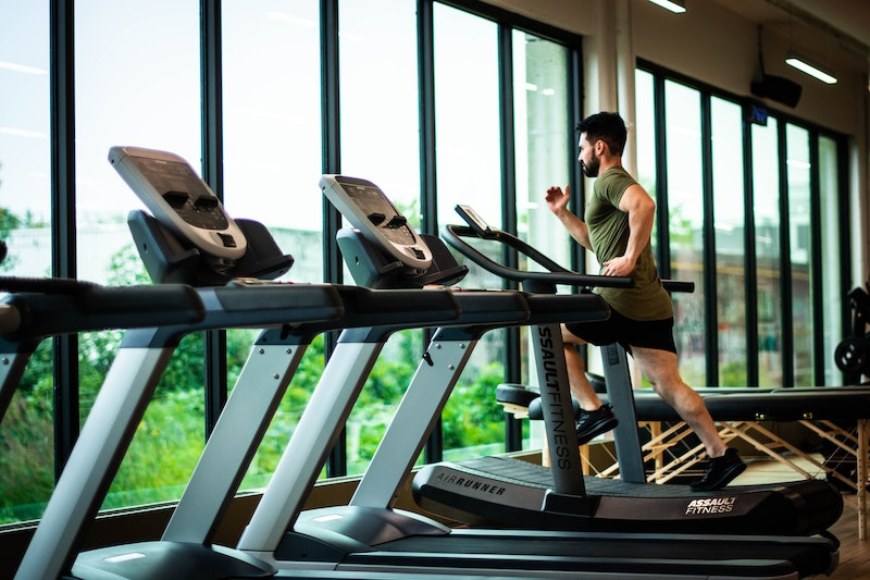 Inside one of the eco gyms, a man runs on a treadmill