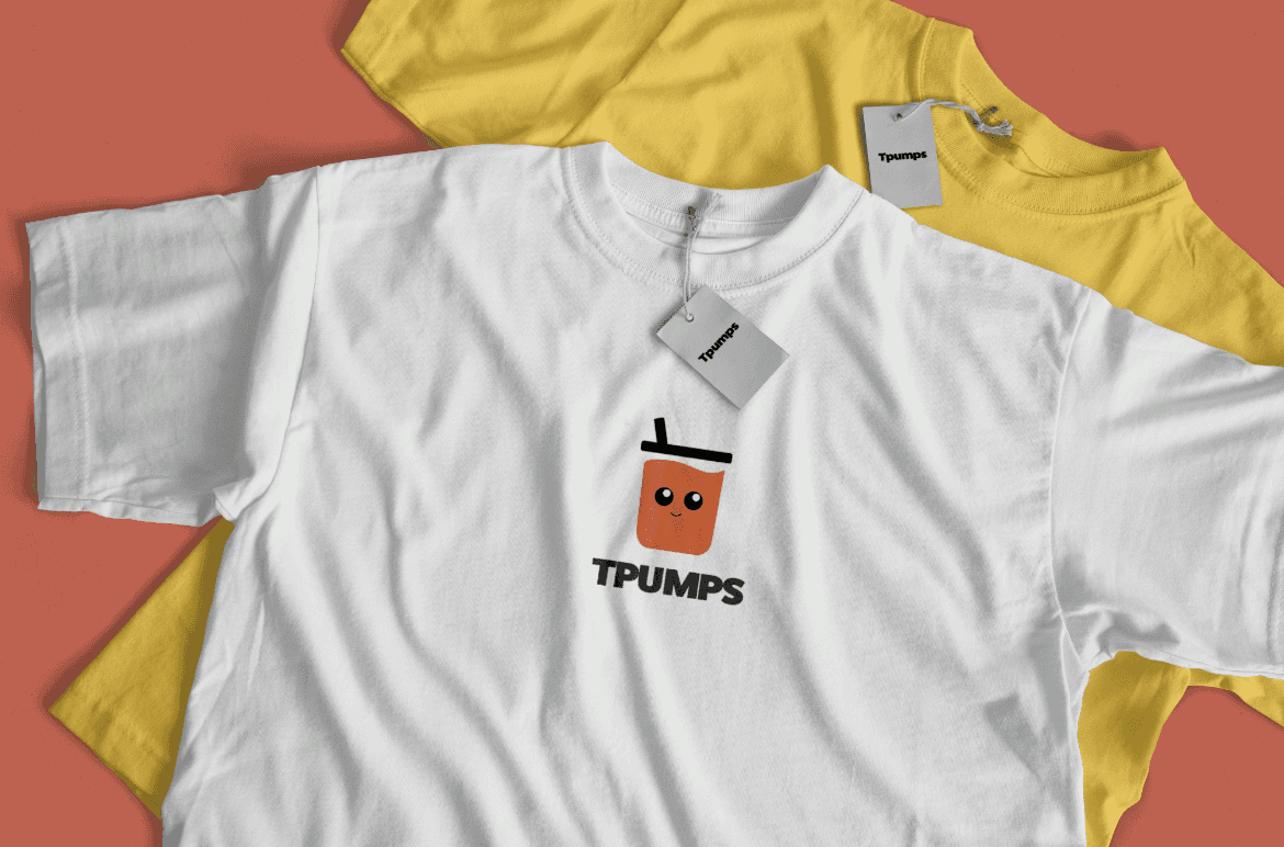 A white t-shirt carrying the new T-Pumps cup mark, over a yellow shirt on a burnt orange backdrop.