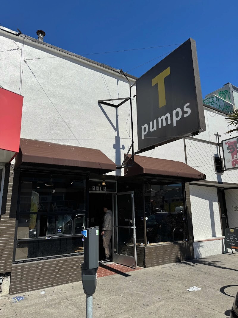 The T-Pumps storefront, with its black blade sign over the door.