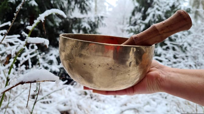 Tibetan Meditation Bowl with snow in the background.