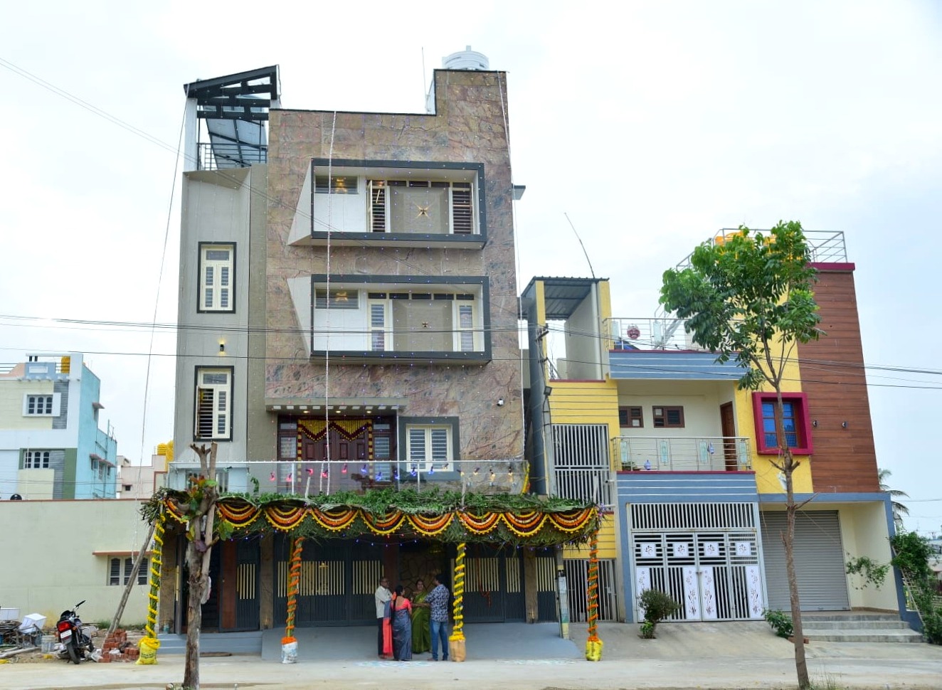 G+3 commercial and residential stone-clad building Hoskote, housewarming