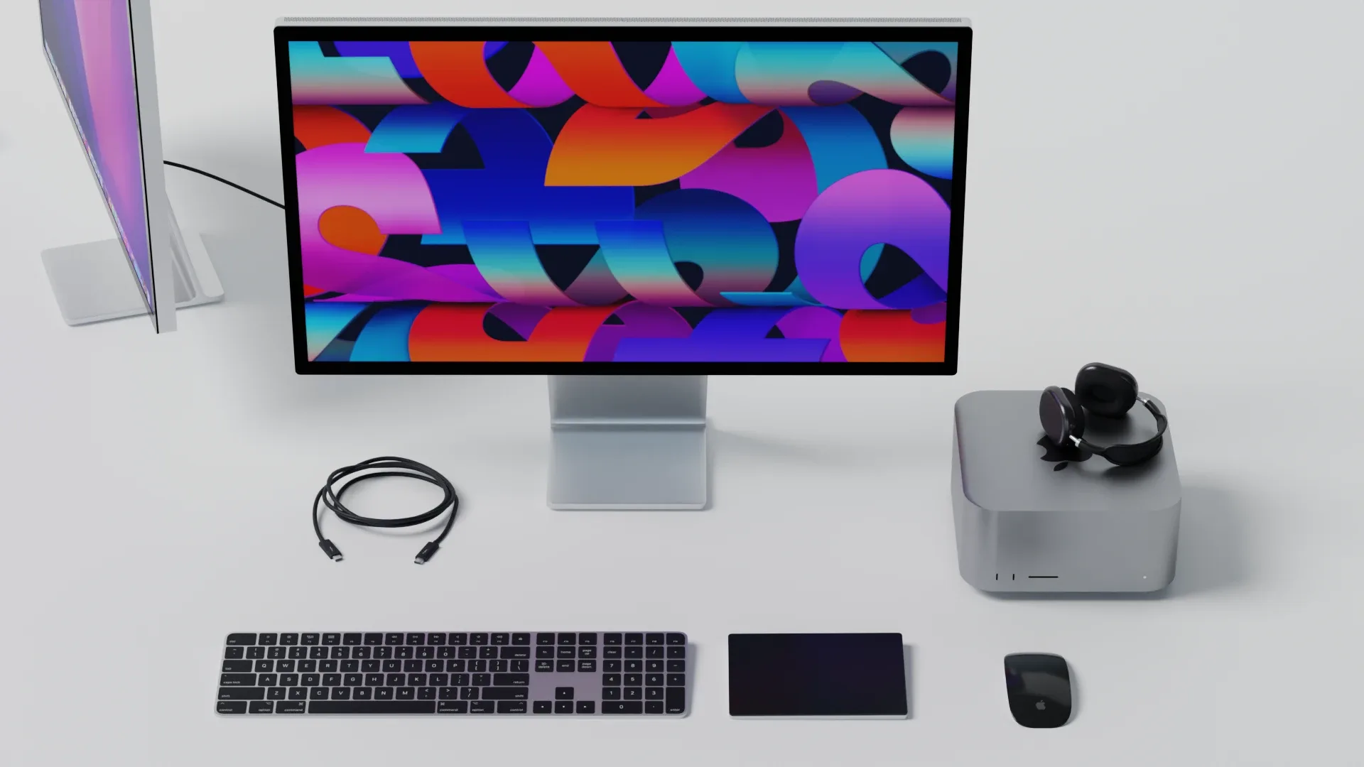 Mac Studio 2022 with keyboard mouse trackpad and airPods Max