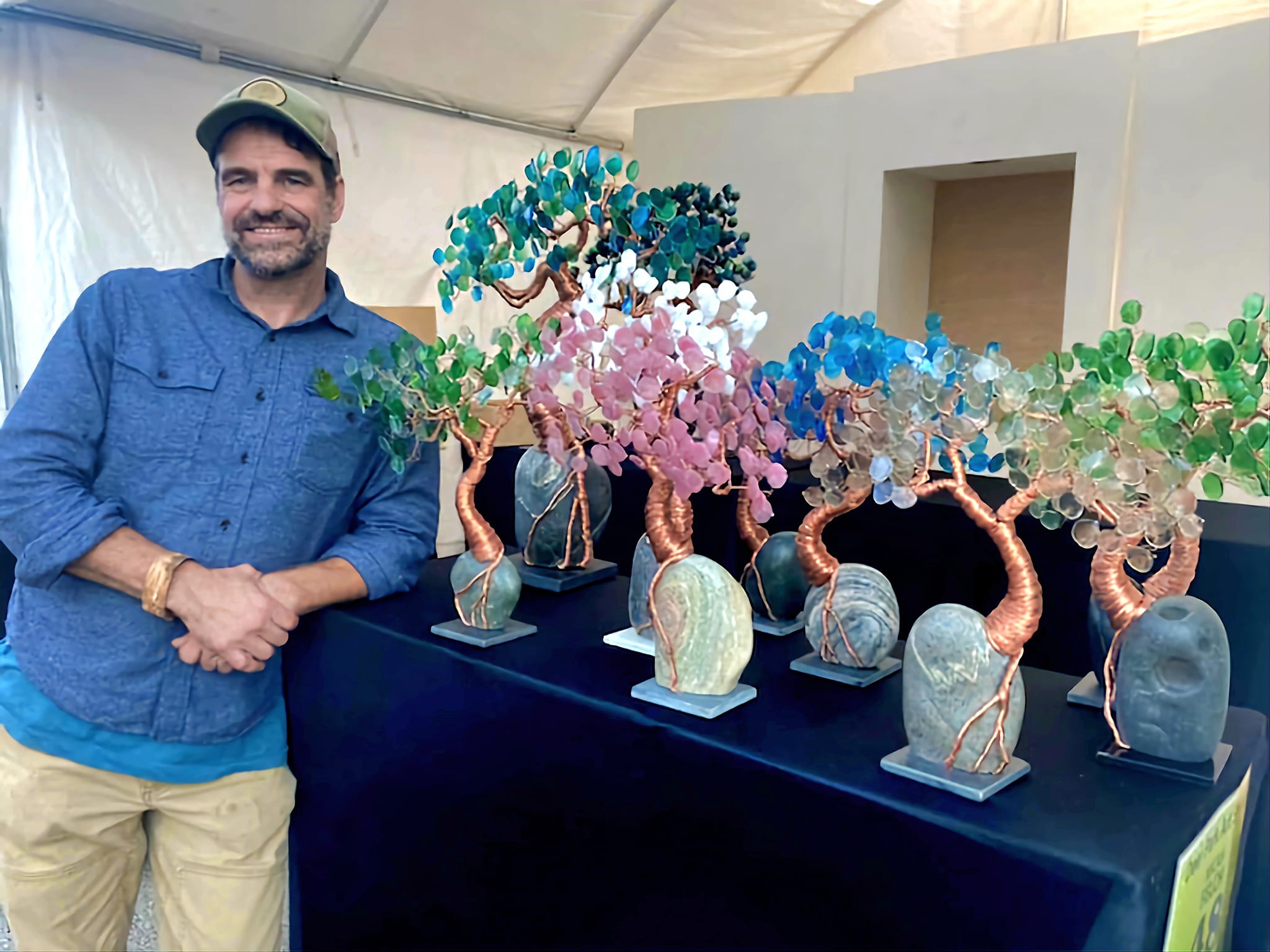 Micah with his Dream Tree sculptures