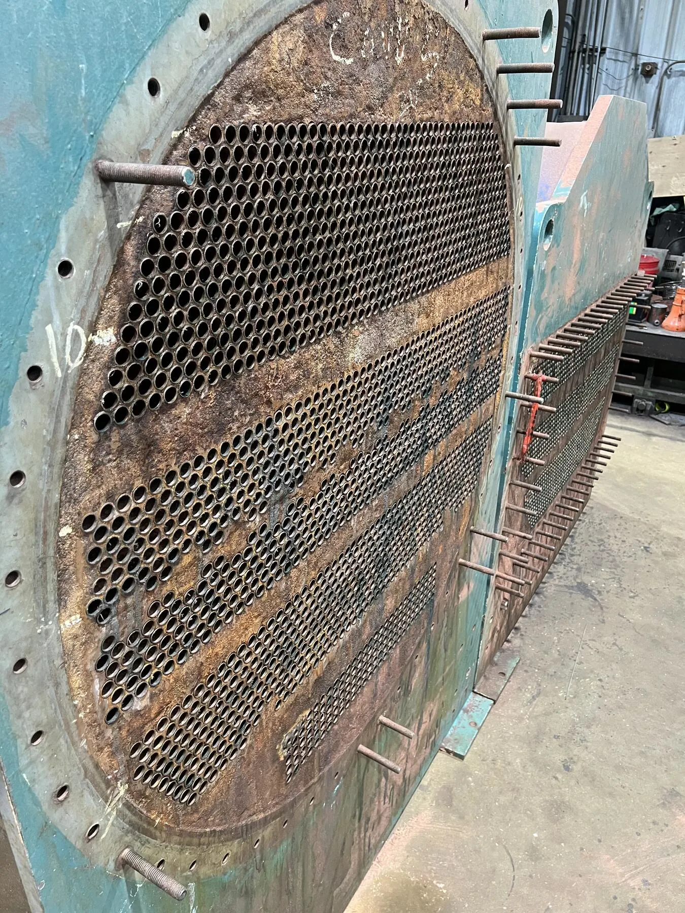 Round tubesheet with rust and pitting before coating
