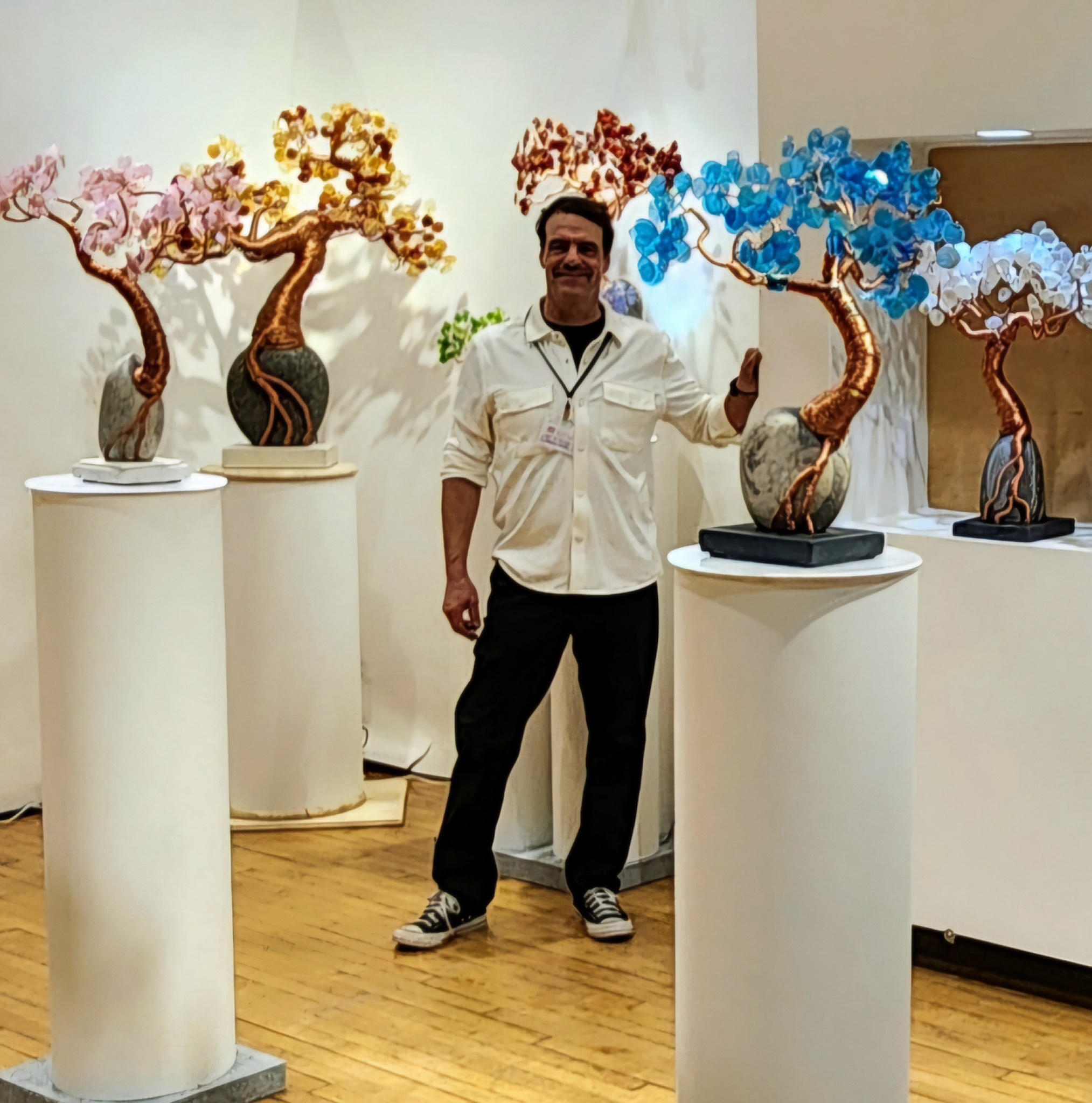 Micah with his Dream Tree sculptures