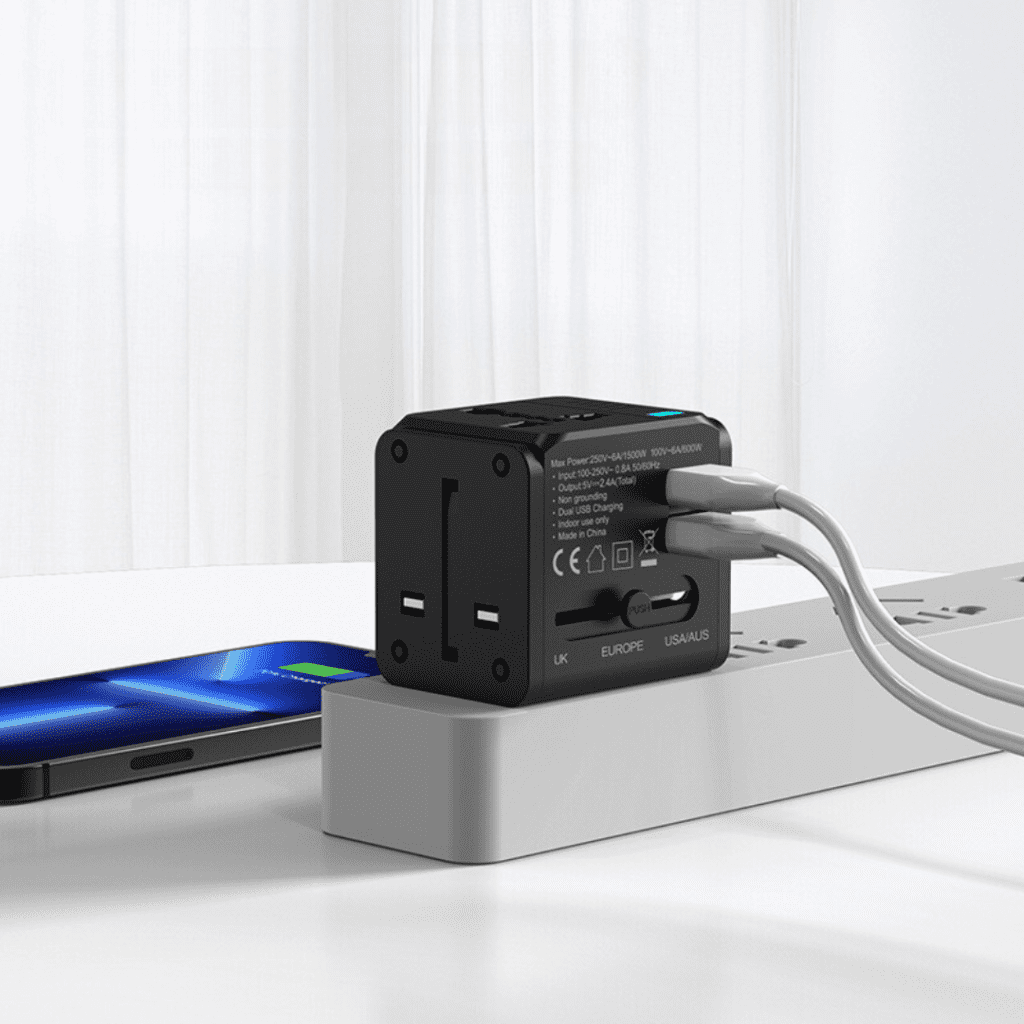 Compact multi-port USB charger with international plugs, perfect for modern devices and travel.
