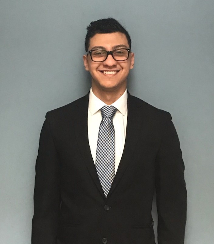 Bola Ghaly wearing a suit