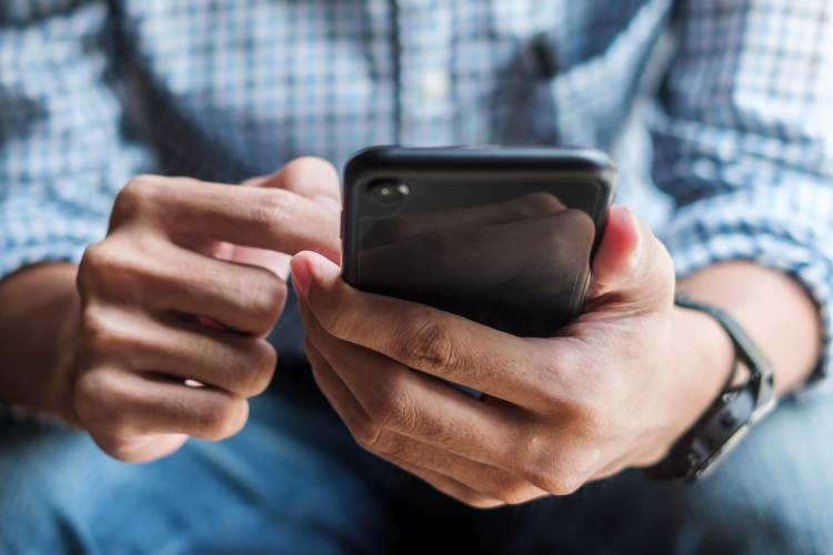 young man with mobile device