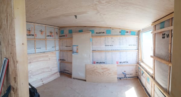 Bureau ossature bois dans un entrepôt - Isolation et membrane d'étanchéité à l'air