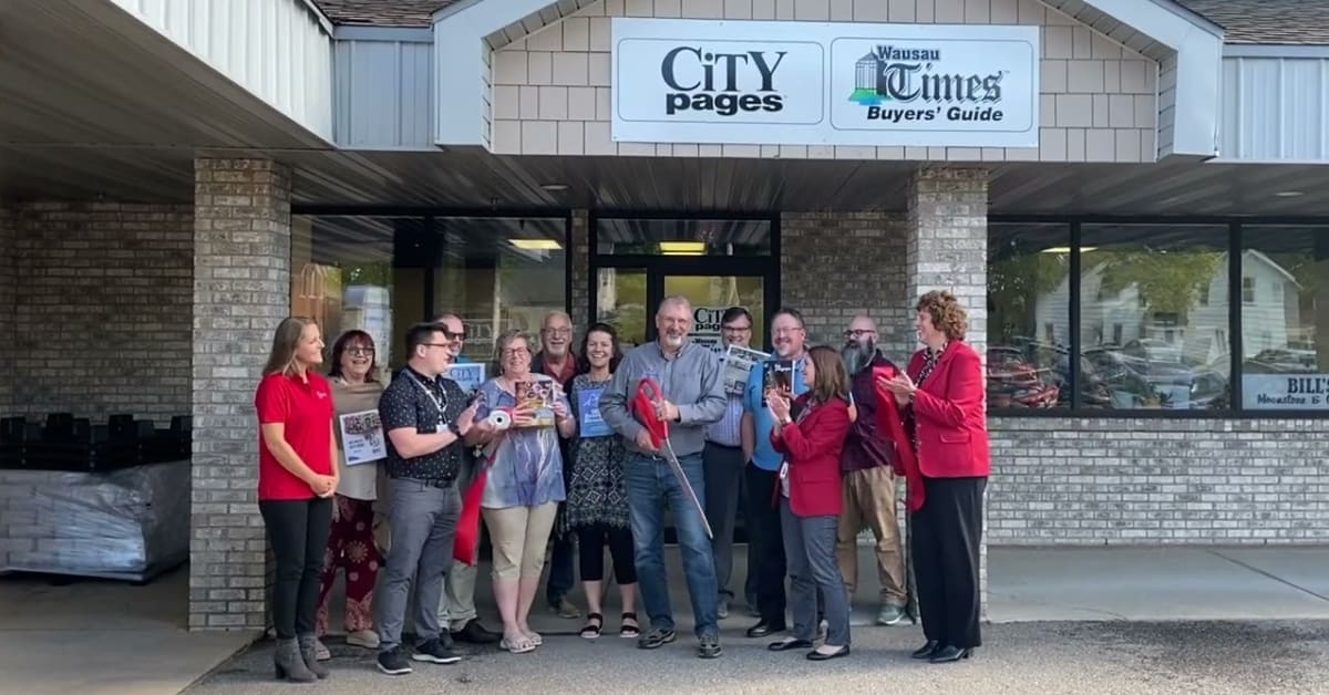 Ribbon cutting at new headquarters of the Wausau Times/Buyer