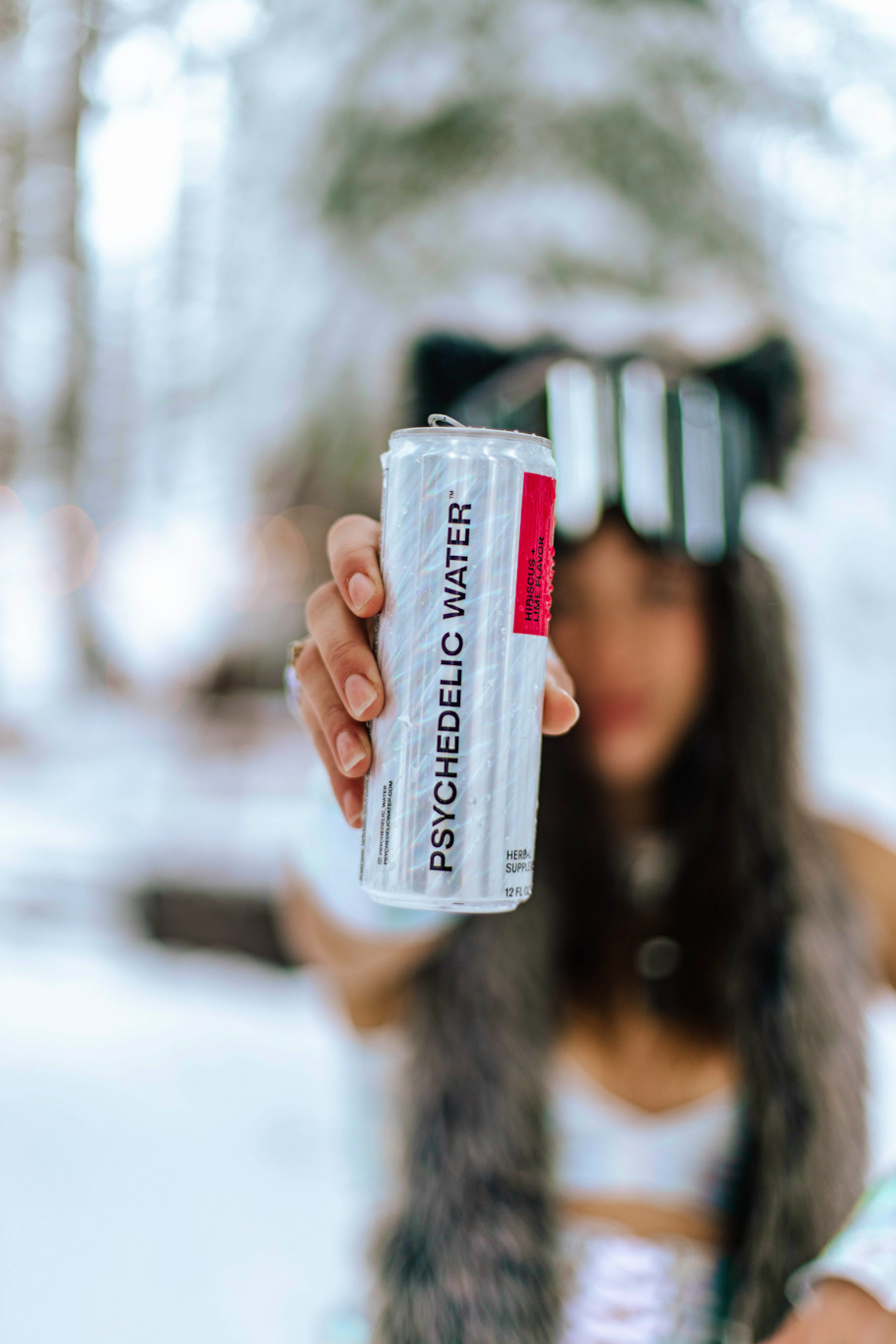 A can of Psychedelic Water herbal supplement beverage.